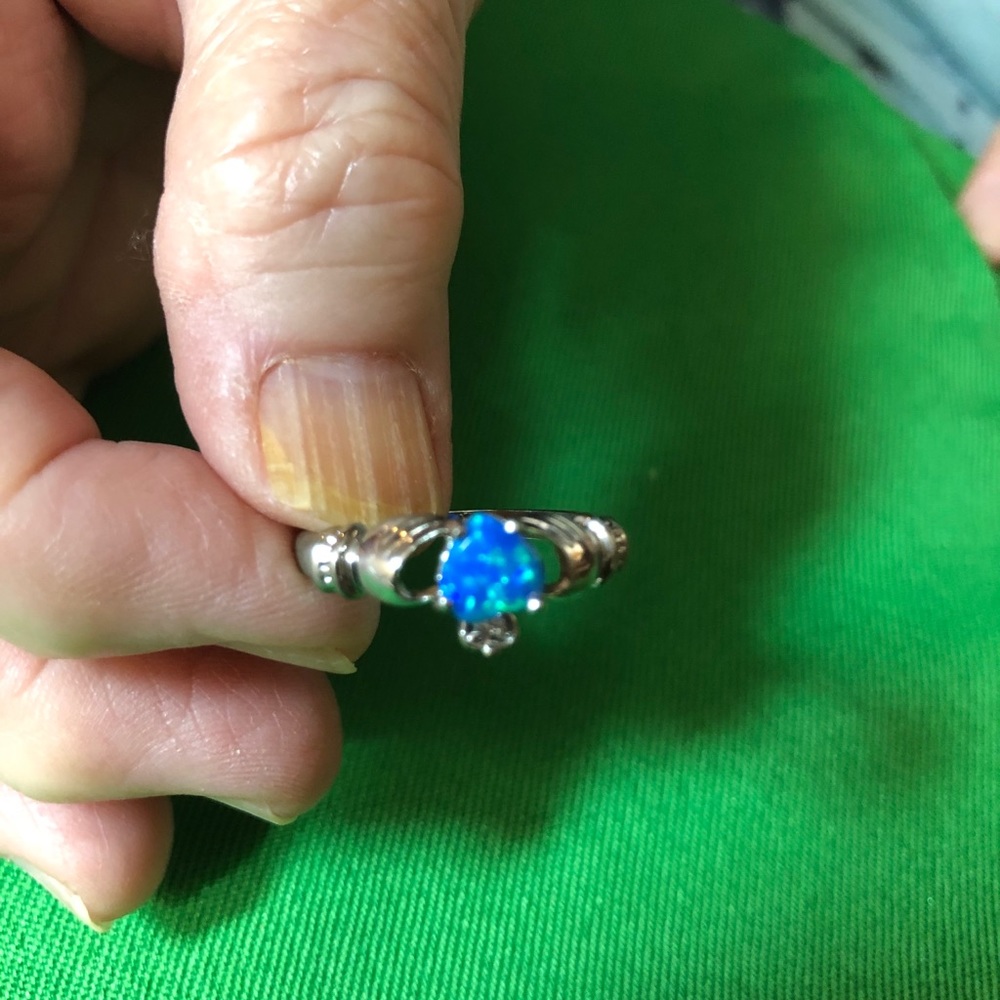 Selling  a sterling silver ring with an opal stone